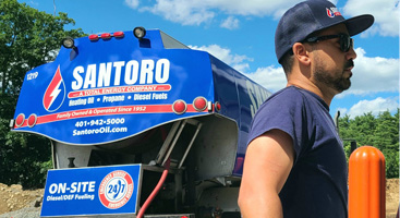 Santoro Oil driver steps away from his truck to complete his oil delivery